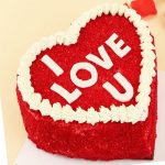 A Rainbow Cake with a Romantic Caption on the Top